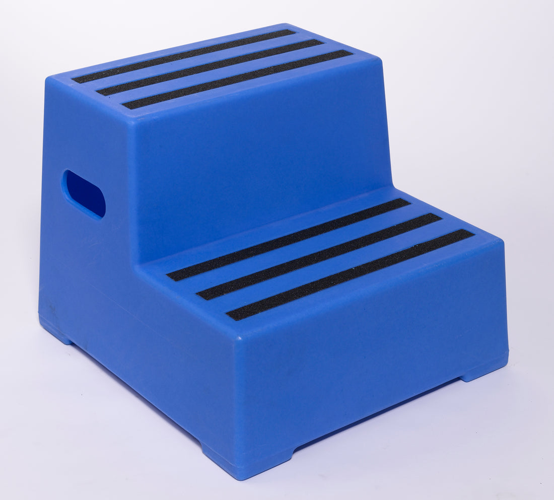 Red step stool with black stripes on a white background