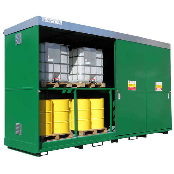 Green safety storage unit with pallets of drums inside on a white background